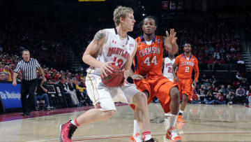 COLLEGE PARK, MD - JANUARY 22: Haukur Palsson #13 of the Maryland Terrapins drives to the hoop against DeAndre Hopkins #44 of the Clemson Tigers at the Comcast Center on January 22, 2011 in College Park, Maryland. (Photo by G Fiume/Maryland Terrapins/Getty Images)