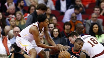 HOUSTON, TEXAS - JANUARY 11: Gary Clark #6 of the Houston Rockets fight for the loose ball with Matthew Dellavedova #18 of the Cleveland Cavaliers and Cameron Payne #3 at Toyota Center on January 11, 2019 in Houston, Texas. NOTE TO USER: User expressly acknowledges and agrees that, by downloading and or using this photograph, User is consenting to the terms and conditions of the Getty Images License Agreement. (Photo by Bob Levey/Getty Images)