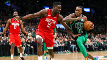 Terry Rozier #12 of the Boston Celtics drives to the basket past Clint Capela #15 of the Houston Rockets (Photo by Adam Glanzman/Getty Images)
