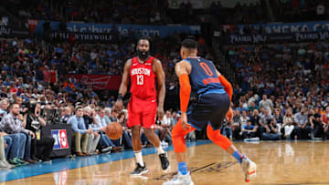 James Harden #13 of the Houston Rockets handles the ball against Russell Westbrook #0 of the Oklahoma City Thunder (Photo by Zach Beeker/NBAE via Getty Images)