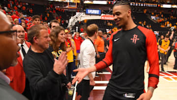 Owner Tilman Fertitta is seen with Gerald Green #14 of the Houston Rockets during the game against the Utah Jazz (Photo by Bill Baptist/NBAE via Getty Images)