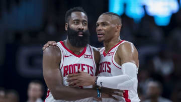 James Harden #13 of the Houston Rockets speaks with Russell Westbrook #0 (Photo by Scott Taetsch/Getty Images)