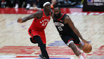 SAITAMA, JAPAN - OCTOBER 10: James Harden #13 of Houston Rockets drives to the basket against Pascal Siakam #43 of Toronto Raptors during the preseason match between Toronto Raptors and Houston Rockets at Saitama Super Arena on October 10, 2019 in Saitama, Japan. NOTE TO USER: User expressly acknowledges and agrees that, by downloading and/or using this photograph, user is consenting to the terms and conditions of the Getty Images License Agreement. (Photo by Takashi Aoyama/Getty Images)