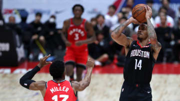 SAITAMA, JAPAN - OCTOBER 10: Gerald Green #14 of Houston Rockets shoots against Malcolm Miller #13 of Toronto Raptors during the preseason game between Toronto Raptors and Houston Rockets at Saitama Super Arena on October 10, 2019 in Saitama, Japan. NOTE TO USER: User expressly acknowledges and agrees that, by downloading and/or using this photograph, user is consenting to the terms and conditions of the Getty Images License Agreement. (Photo by Takashi Aoyama/Getty Images)