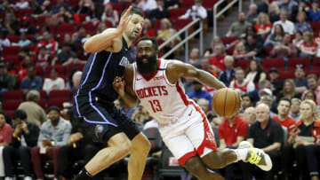 HOUSTON, TEXAS - MARCH 08: James Harden #13 of the Houston Rockets drives to the basket while defended by Nikola Vucevic #9 of the Orlando Magic in the second half at Toyota Center on March 08, 2020 in Houston, Texas. NOTE TO USER: User expressly acknowledges and agrees that, by downloading and or using this photograph, User is consenting to the terms and conditions of the Getty Images License Agreement. (Photo by Tim Warner/Getty Images)