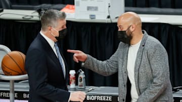 General Manager Neil Olshey of the Portland Trail Blazers speaks with General Manager Rafael Stone of the Houston Rockets (Photo by Steph Chambers/Getty Images)