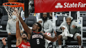 PORTLAND, OREGON - DECEMBER 26: Jae'Sean Tate #8 of the Houston Rockets shoots past CJ McCollum #3 of the Portland Trail Blazers during the second quarter at Moda Center on December 26, 2020 in Portland, Oregon. NOTE TO USER: User expressly acknowledges and agrees that, by downloading and/or using this photograph, user is consenting to the terms and conditions of the Getty Images License Agreement. (Photo by Steph Chambers/Getty Images)