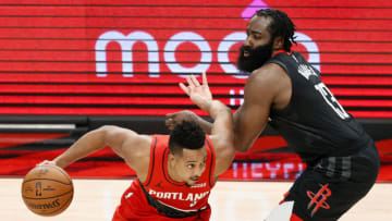 CJ McCollum #3 of the Portland Trail Blazers dribbles past James Harden #13 of the Houston Rockets (Photo by Steph Chambers/Getty Images)