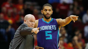HOUSTON, TX - DECEMBER 21: Head coach Steve Clifford and Nicolas Batum #5 of the Charlotte Hornets watch the action on the court during their game against the Houston Rockets at Toyota Center on December 21, 2015 in Houston, Texas. NOTE TO USER: User expressly acknowledges and agrees that, by downloading and or using this Photograph, user is consenting to the terms and conditions of the Getty Images License Agreement. (Photo by Scott Halleran/Getty Images)