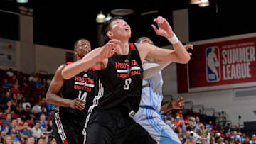 LAS VEGAS, NV - JULY 7: Zhou Qi #9 of the Houston Rockets looks to rebound in a game against the Denver Nuggets during the 2017 Las Vegas Summer League on July 7, 2017 at the Cox Pavilion in Las Vegas, Nevada. NOTE TO USER: User expressly acknowledges and agrees that, by downloading and or using this Photograph, user is consenting to the terms and conditions of the Getty Images License Agreement. Mandatory Copyright Notice: Copyright 2017 NBAE (Photo by David Dow/NBAE via Getty Images)