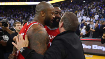 PJ Tucker #4, James Harden #13 and team owner Tilman Fertitta of the Houston Rockets (Photo by Ezra Shaw/Getty Images)