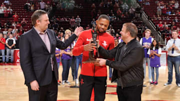 HOUSTON, TX - OCTOBER 23: The Houston Rockets new owner Tilman Fertitta and GM Daryl Morey present Eric Gordon #10 of the Houston Rockets with the 6th Man of the Year Award before the game against the Memphis Grizzlies on October 23, 2017 at the Toyota Center in Houston, Texas. NOTE TO USER: User expressly acknowledges and agrees that, by downloading and or using this photograph, User is consenting to the terms and conditions of the Getty Images License Agreement. Mandatory Copyright Notice: Copyright 2017 NBAE (Photo by Bill Baptist/NBAE via Getty Images)