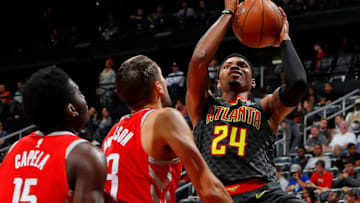 ATLANTA, GA - NOVEMBER 03: Kent Bazemore #24 of the Atlanta Hawks drives against Clint Capela #15 and Ryan Anderson #33 of the Houston Rockets at Philips Arena on November 3, 2017 in Atlanta, Georgia. NOTE TO USER: User expressly acknowledges and agrees that, by downloading and or using this photograph, User is consenting to the terms and conditions of the Getty Images License Agreement. (Photo by Kevin C. Cox/Getty Images)