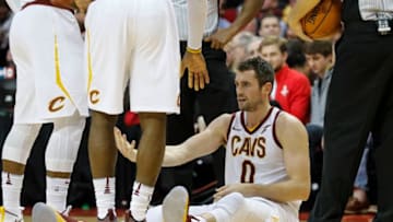 HOUSTON, TX - NOVEMBER 09: Kevin Love #0 of the Cleveland Cavaliers is helped from the floor in the first half against the Houston Rockets at Toyota Center on November 09, 2017 in Houston, Texas. NOTE TO USER: User expressly acknowledges and agrees that, by downloading and or using this photograph, User is consenting to the terms and conditions of the Getty Images License Agreement. (Photo by Tim Warner/Getty Images)