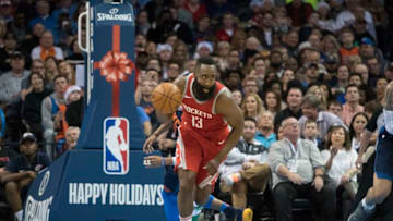 OKLAHOMA CITY, OK - DECEMBER 25: James Harden #13 of the Houston Rockets steals the ball away Andre Roberson #21 of the Oklahoma City Thunder during the second half of a NBA game at the Chesapeake Energy Arena on December 25, 2017 in Oklahoma City, Oklahoma. The Thunder defeated the Rockets 112-107. NOTE TO USER: User expressly acknowledges and agrees that, by downloading and or using this photograph, User is consenting to the terms and conditions of the Getty Images License Agreement. (Photo by J Pat Carter/Getty Images)