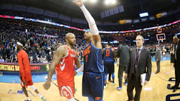 OKLAHOMA CITY, OK- DECEMBER 25: PJ Tucker #4 of the Houston Rockets and Carmelo Anthony #7 of the Oklahoma City Thunder exchange a hug after the game between the two teams on December 25, 2017 at Chesapeake Energy Arena in Oklahoma City, Oklahoma. NOTE TO USER: User expressly acknowledges and agrees that, by downloading and or using this photograph, User is consenting to the terms and conditions of the Getty Images License Agreement. Mandatory Copyright Notice: Copyright 2017 NBAE (Photo by Layne Murdoch Sr./NBAE via Getty Images)