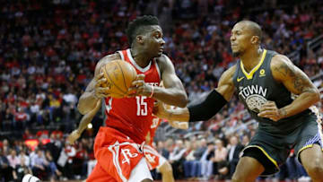 HOUSTON, TX - JANUARY 20: Clint Capela #15 of the Houston Rockets drives on David West #3 of the Golden State Warriors at Toyota Center on January 20, 2018 in Houston, Texas. NOTE TO USER: User expressly acknowledges and agrees that, by downloading and or using this photograph, User is consenting to the terms and conditions of the Getty Images License Agreement. (Photo by Bob Levey/Getty Images)