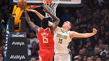 DENVER, CO - FEBRUARY 25: Nikola Jokic #15 of the Denver Nuggets defends against Clint Capela #15 of the Houston Rockets at Pepsi Center on February 25, 2018 in Denver, Colorado. NOTE TO USER: User expressly acknowledges and agrees that, by downloading and or using this photograph, User is consenting to the terms and conditions of the Getty Images License Agreement. (Photo by Justin Tafoya/Getty Images)