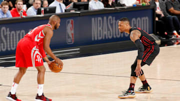 PORTLAND, OR - MARCH 20: Chris Paul #3 of the Houston Rockets handles the ball against Damian Lillard #0 of the Portland Trail Blazers on March 20, 2018 at the Moda Center in Portland, Oregon. NOTE TO USER: User expressly acknowledges and agrees that, by downloading and or using this Photograph, user is consenting to the terms and conditions of the Getty Images License Agreement. Mandatory Copyright Notice: Copyright 2018 NBAE (Photo by Cameron Browne/NBAE via Getty Images)