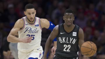 Caris LeVert #22 of the Brooklyn Nets drives to the basket against Ben Simmons #25 of the Philadelphia 76ers (Photo by Mitchell Leff/Getty Images)