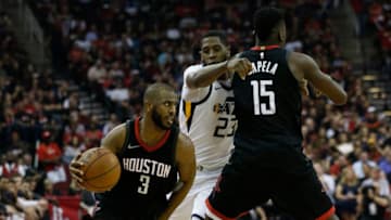 HOUSTON, TX - MAY 08: Chris Paul #3 of the Houston Rockets drives past Royce O'Neale #23 of the Utah Jazz as he receives a pick from Clint Capela #15 during Game Five of the Western Conference Semifinals of the 2018 NBA Playoffs at Toyota Center on May 8, 2018 in Houston, Texas. NOTE TO USER: User expressly acknowledges and agrees that, by downloading and or using this photograph, User is consenting to the terms and conditions of the Getty Images License Agreement. (Photo by Bob Levey/Getty Images)