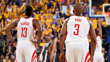 OAKLAND, CA - MAY 22: James Harden #13 and Chris Paul #3 of the Houston Rockets look on during Game Four of the Western Conference Finals during the 2018 NBA Playoffs on May 20, 2018 at ORACLE Arena in Oakland, California. NOTE TO USER: User expressly acknowledges and agrees that, by downloading and/or using this Photograph, user is consenting to the terms and conditions of the Getty Images License Agreement. Mandatory Copyright Notice: Copyright 2018 NBAE (Photo by Andrew D. Bernstein/NBAE via Getty Images)