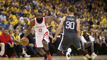 James Harden #13 of the Houston Rockets is guarded by Stephen Curry #30 of the Golden State Warriors (Photo by Ezra Shaw/Getty Images)