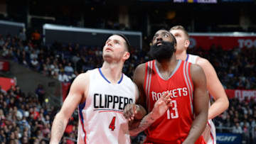 LOS ANGELES, CA - JANUARY 18: J.J. Redick #4 of the Los Angeles Clippers looks for the rebound against James Harden #13 of the Houston Rockets during the game on January 18, 2016 at STAPLES Center in Los Angeles, California. NOTE TO USER: User expressly acknowledges and agrees that, by downloading and or using this Photograph, user is consenting to the terms and conditions of the Getty Images License Agreement. Mandatory Copyright Notice: Copyright 2016 NBAE (Photo by Andrew Bernstein/NBAE via Getty Images)