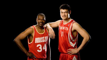 HOUSTON - JUNE 12: Former NBA player Hakeem Olajuwon and Yao Ming #11 of the Houston Rockets pose for photos at the Toyota Center on June 12, 2007 in Houston, Texas. NOTE TO USER: User expressly acknowledges and agrees that, by downloading and/or using this photograph, User is consenting to the terms and conditions of the Getty Images License Agreement. Mandatory Copyright Notice: Copyright 2007 NBAE (Photo by Bill Baptist/NBAE via Getty Images)