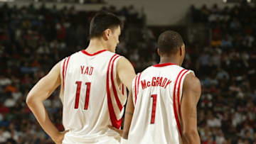 HOUSTON - FEBRUARY 21: Yao Ming #11 and Tracy McGrady #1 of the Houston Rockets stand on the court during the game against the Miami Heat on February 21, 2008 at the Toyota Center in Houston, Texas. The Rockets won 112-100. NOTE TO USER: User expressly acknowledges and agrees that, by downloading and or using this Photograph, user is consenting to the terms and conditions of the Getty Images License Agreement. Mandatory Copyright Notice: Copyright 2008 NBAE (Photo by Bill Baptist/NBAE via Getty Images)