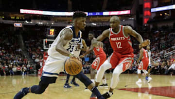 HOUSTON, TX - JANUARY 18: Jimmy Butler #23 of the Minnesota Timberwolves drives to the basket defended by Luc Mbah a Moute #12 of the Houston Rockets in the second half at Toyota Center on January 18, 2018 in Houston, Texas. NOTE TO USER: User expressly acknowledges and agrees that, by downloading and or using this Photograph, user is consenting to the terms and conditions of the Getty Images License Agreement. (Photo by Tim Warner/Getty Images)
