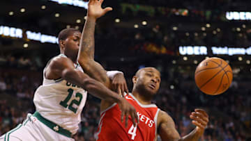 BOSTON, MA - DECEMBER 28: Boston Celtics Terry Rozier, left, knocks the ball away from Houston Rockets P.J. Tucker, right, during the fourth quarter of a game at the TD Garden in Boston, Dec. 28, 2017. (Photo by John Tlumacki/The Boston Globe via Getty Images)