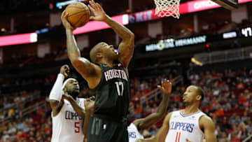HOUSTON, TX - OCTOBER 26: PJ Tucker #17 of the Houston Rockets goes up for a shot defended by Avery Bradley #11 of the Los Angeles Clippers and Montrezl Harrell #5 in the first half at Toyota Center on October 26, 2018 in Houston, Texas. NOTE TO USER: User expressly acknowledges and agrees that, by downloading and or using this Photograph, user is consenting to the terms and conditions of the Getty Images License Agreement. (Photo by Tim Warner/Getty Images)