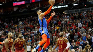 Russell Westbrook #0 of the Oklahoma City Thunder goes up for a lay up in the fourth quarter defended by Chris Paul #3 of the Houston Rockets and PJ Tucker #17 (Photo by Tim Warner/Getty Images)
