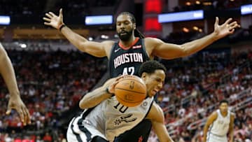 DeMar DeRozan #10 of the San Antonio Spurs drives to the basket defended by Nene Hilario #42 of the Houston Rockets (Photo by Tim Warner/Getty Images)