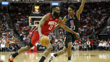 James Harden #13 of the Houston Rockets drives to the basket while defended by Lou Williams #23 of the LA Clippers (Photo by Tim Warner/Getty Images)