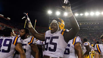 Oct 11, 2014; Gainesville, FL, USA; LSU Tigers offensive tackle Jerald Hawkins (65) reacts after they beat the Florida Gators at Ben Hill Griffin Stadium. LSU Tigers defeated the Florida Gators 30-27. Mandatory Credit: Kim Klement-USA TODAY Sports