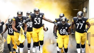 Sep 28, 2014; Pittsburgh, PA, USA; Pittsburgh Steelers center Maurkice Pouncey (53) leads the offense onto the field to play the Tampa Bay Buccaneers at Heinz Field. The Buccaneers won 27-24. Mandatory Credit: Charles LeClaire-USA TODAY Sports