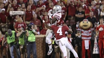 Sep 17, 2016; Norman, OK, USA; Ohio State Buckeyes wide receiver Noah Brown (80) catches a touchdown pass against Oklahoma Sooners cornerback Parrish Cobb (4) during the first half at Gaylord Family - Oklahoma Memorial Stadium. Mandatory Credit: Kevin Jairaj-USA TODAY Sports