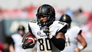 FAYETTEVILLE, AR - OCTOBER 27: Jared Pinkney #80 of the Vanderbilt Commodores runs the ball during a game against the Arkansas Razorbacks at Razorback Stadium on October 27, 2018 in Fayetteville, Arkansas. The Commodores defeated the Razorbacks 45-31. (Photo by Wesley Hitt/Getty Images)
