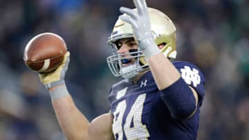 SOUTH BEND, IN - NOVEMBER 23: Cole Kmet #84 of the Notre Dame Fighting Irish celebrates after an 11-yard touchdown reception against the Boston College Eagles in the third quarter at Notre Dame Stadium on November 23, 2019 in South Bend, Indiana. Notre Dame defeated Boston College 40-7. (Photo by Joe Robbins/Getty Images)