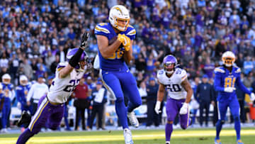 CARSON, CALIFORNIA - DECEMBER 15: Hunter Henry #86 of the Los Angeles Chargers makes a catch for a first down in front of Harrison Smith #22 of the Minnesota Vikings during a 39-10 Vikings win at Dignity Health Sports Park on December 15, 2019 in Carson, California. (Photo by Harry How/Getty Images)