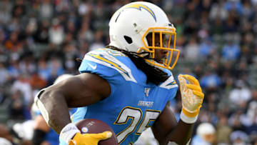 CARSON, CALIFORNIA - DECEMBER 22: Melvin Gordon #25 of the Los Angeles Chargers runs after his catch during the first quarter against the Oakland Raiders at Dignity Health Sports Park on December 22, 2019 in Carson, California. (Photo by Harry How/Getty Images)