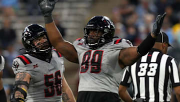 ARLINGTON, TEXAS - MARCH 07: Cavon Walker #99 of the New York Guardians celebrates after sacking quarterback Philip Nelson of the Dallas Renegades at an XFL football game on March 07, 2020 in Arlington, Texas. (Photo by Richard Rodriguez/Getty Images)