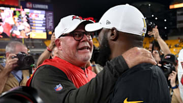 Bruce Arians of the Tampa Bay Buccaneers hugs head coach Mike Tomlin of the Pittsburgh Steelers. (Photo by Justin Berl/Getty Images)