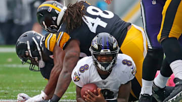 PITTSBURGH, PA - OCTOBER 06: Lamar Jackson #8 of the Baltimore Ravens smiles after being tackled by Bud Dupree #48 of the Pittsburgh Steelers on October 6, 2019 at Heinz Field in Pittsburgh, Pennsylvania. (Photo by Justin K. Aller/Getty Images)
