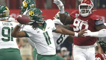 ARLINGTON, TX - DECEMBER 07: Gerry Bohanon #11 of the Baylor Bears passes the ball over Neville Gallimore #90 of the Oklahoma Sooners in the second quarter of the Big 12 Football Championship at AT&T Stadium on December 7, 2019 in Arlington, Texas. (Photo by Ron Jenkins/Getty Images)