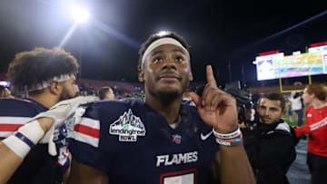 MOBILE, ALABAMA - DECEMBER 18: Malik Willis #7 of the Liberty Flames celebrates after winning the LendingTree Bowl against the Eastern Michigan Eagles at Hancock Whitney Stadium on December 18, 2021 in Mobile, Alabama. (Photo by Jonathan Bachman/Getty Images)
