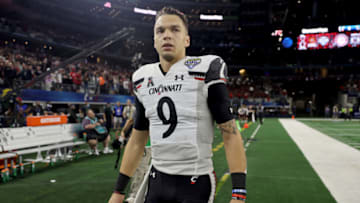 ARLINGTON, TEXAS - DECEMBER 31: Quarterback Desmond Ridder #9 of the Cincinnati Bearcats leaves the field after his team lost to the Alabama Crimson Tide during the Goodyear Cotton Bowl Classic for the College Football Playoff semifinal game at AT&T Stadium on December 31, 2021 in Arlington, Texas. (Photo by Matthew Stockman/Getty Images)