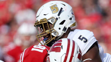MADISON, WI - SEPTEMBER 10: Ulysees Gilbert III #5 of the Akron Zips tackles Troy Fumagalli #81 of the Wisconsin Badgers in the third quarter at Camp Randall Stadium on September 10, 2016 in Madison, Wisconsin. (Photo by Dylan Buell/Getty Images)